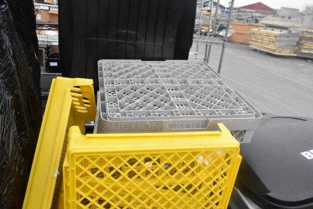 Rubbermaid gray poly trash can with yellow and gray caddies inside. Good condition, suitable for organizational use.