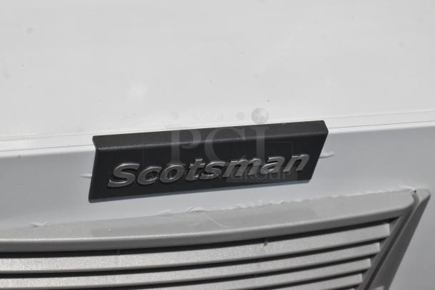 Brand new 2024 Scotsman MC1030MA-32A ice machine, stainless steel, 1077 lb capacity, visible minor dents, 208/230V, 1 phase.