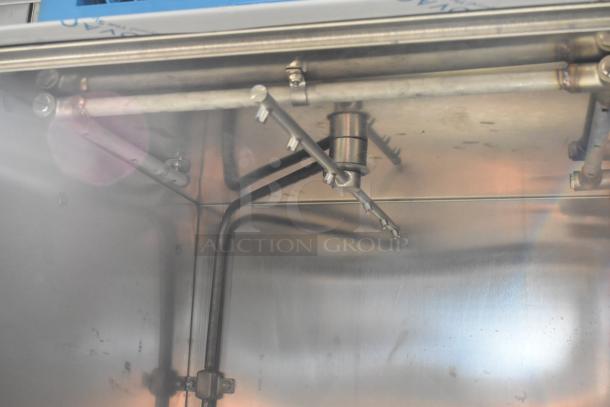 Jackson DISHSTAR HT-E interior view showing stainless steel build, spray arms, and energy-efficient design elements.