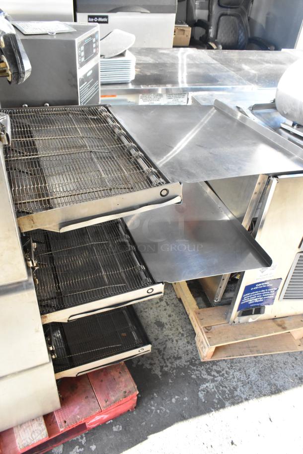 Turbochef HhC2020 stainless steel conveyor oven; 208/240 volts, 3 phase; used condition; features rapid cooking.