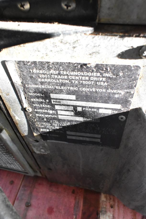 Metal plate showing details of a Turbochef HhC2020 electric conveyor oven, including model, voltage, and serial number.