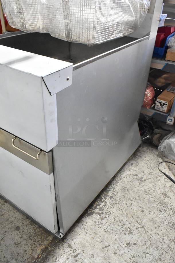 Brand new Dean SR162GN stainless steel commercial gas fryer, 75 lb capacity, includes two metal fry baskets. Scratch and dent condition.