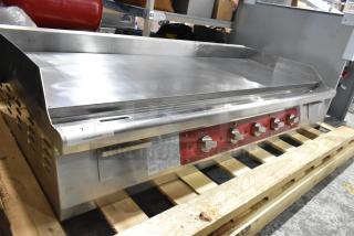 Brand new Avantco 177EG60E 60" stainless steel electric countertop griddle with thermostatic controls and minor scratches.