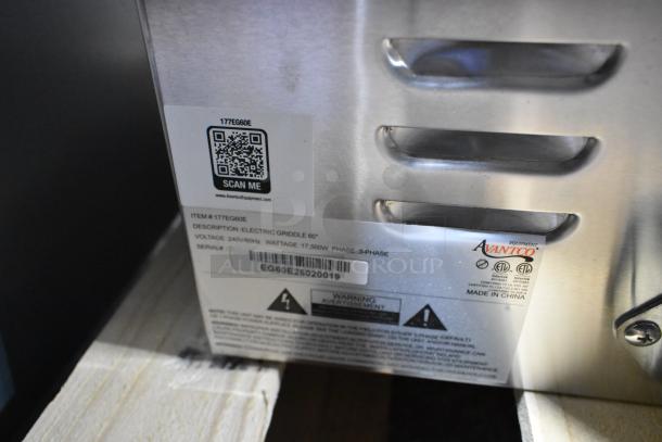 Brand new Avantco 177EG60E stainless steel 60" electric griddle with thermostatic controls. 240V, 3 phase. Scratch and dent condition. Visible labels show QR code, model, and electrical specs.