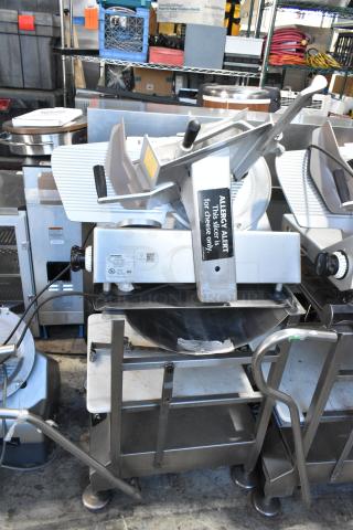 Bizerba SE 12 US commercial meat slicer with blade sharpener, on stainless steel stand. 120V, 1 Phase. "Allergy Alert" label visible.
