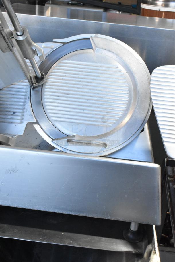 Bizerba SE 12 US metal commercial meat slicer with blade sharpener on stainless steel stand. 120V, 1 Phase.