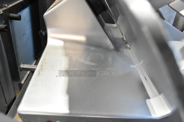 Bizerba SE 12 US commercial meat slicer with blade sharpener. Mounted on stainless steel equipment stand. 120V, 1 phase.