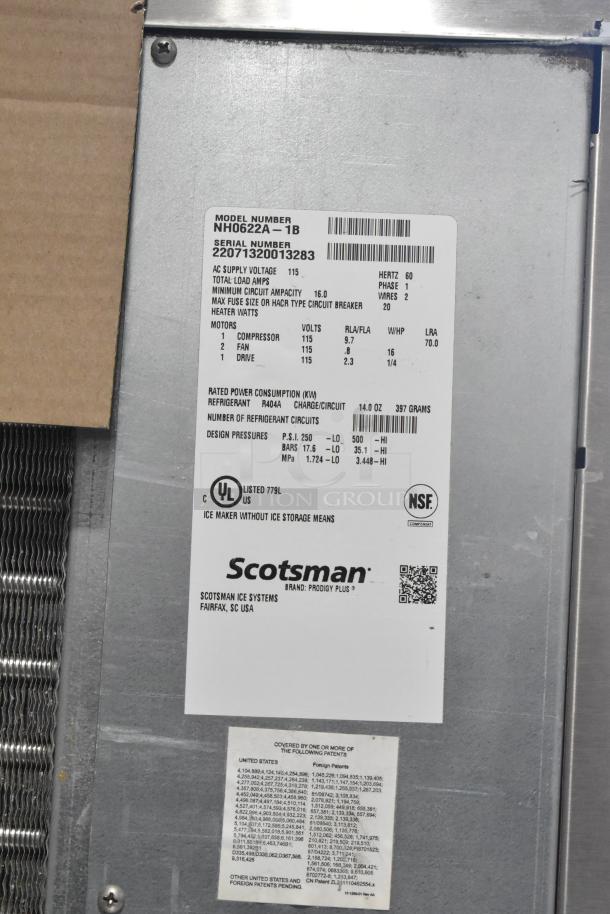 2022 Scotsman NH0622A-1B ice head label showing model, voltage, and certifications, mounted on stainless steel panel.