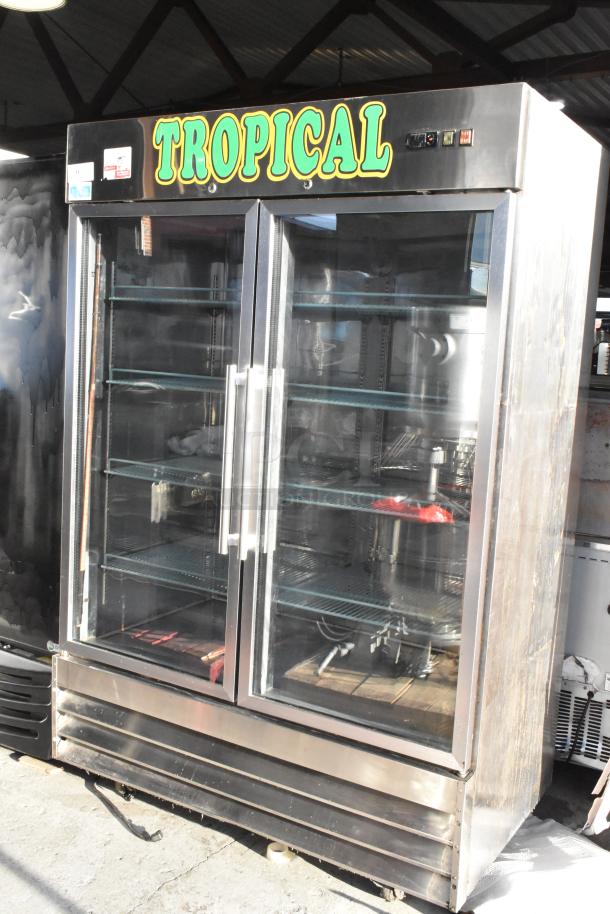 SABA ST-47RG stainless steel 2-door commercial cooler with glass doors and poly coated racks. "Tropical" signage on top.