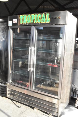 SABA ST-47RG stainless steel 2-door commercial cooler with glass doors and poly coated racks. "Tropical" signage on top.