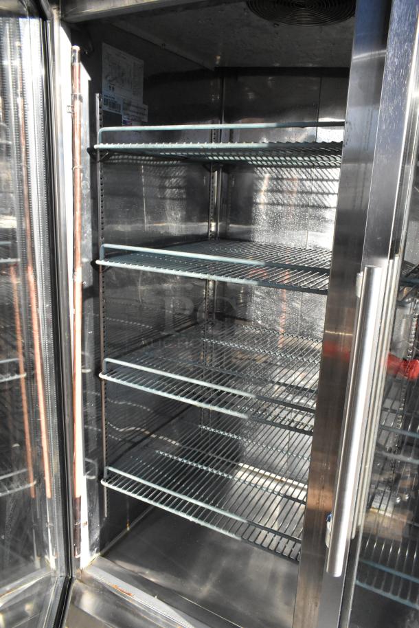 SABA ST-47RG stainless steel 2-door reach-in cooler with poly-coated racks. Model ST-47RG, 115 volts, 1 phase.