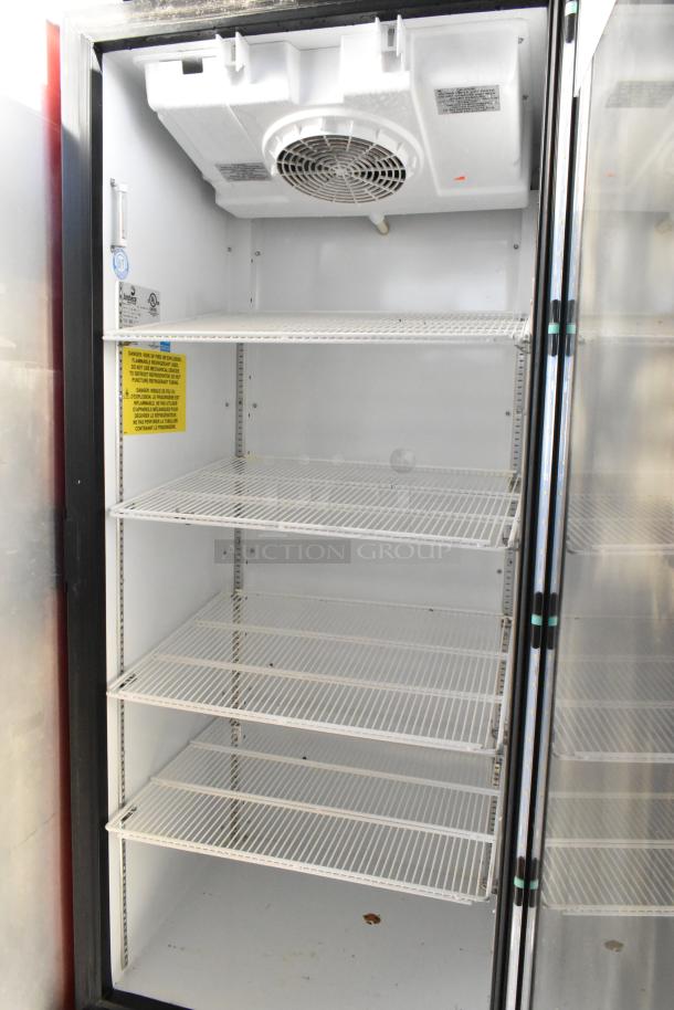 Imbera G319 commercial cooler, single door, 115 volts, with poly-coated racks, clean interior, visible caution labels.