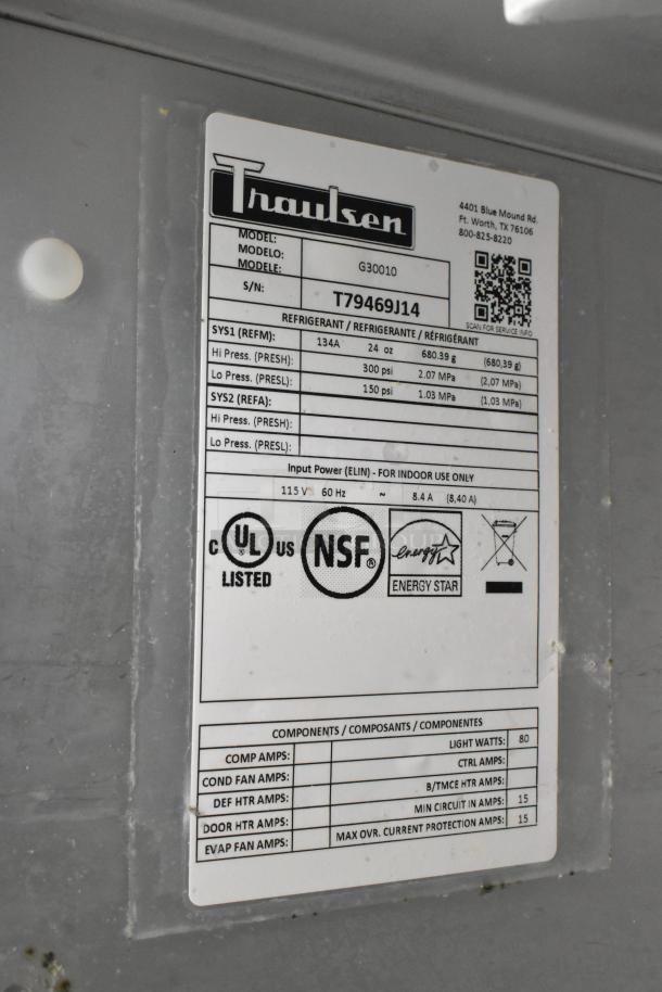Traulsen G30010 stainless steel commercial 3-door reach-in cooler with racks, 115 volts, 1 phase. Label: NSF, UL listed, Energy Star.