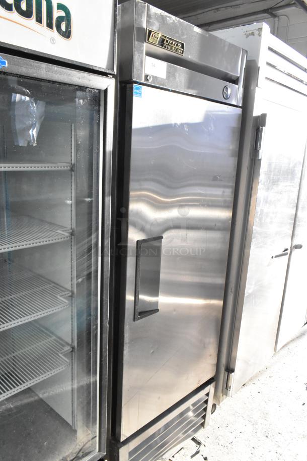 True T-23F stainless steel commercial single door reach-in freezer, 115V, 1 phase. Appears in good condition with intact handle and label.