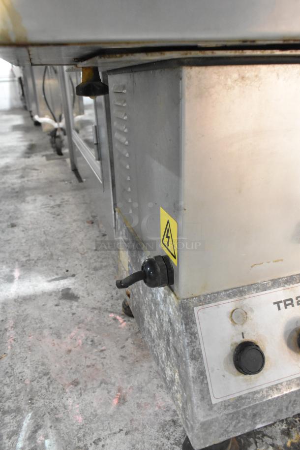 Dito Sama TR250 metal commercial vegetable cutter, countertop model, 230 volts. Shows wear and electrical warning label visible.