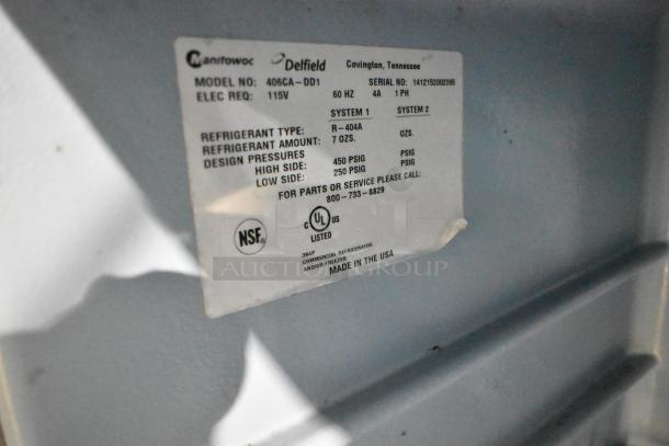 Delfield 406CA-DD1 stainless steel commercial undercounter cooler with caster wheels, 115V, made in the USA; label shows specs.