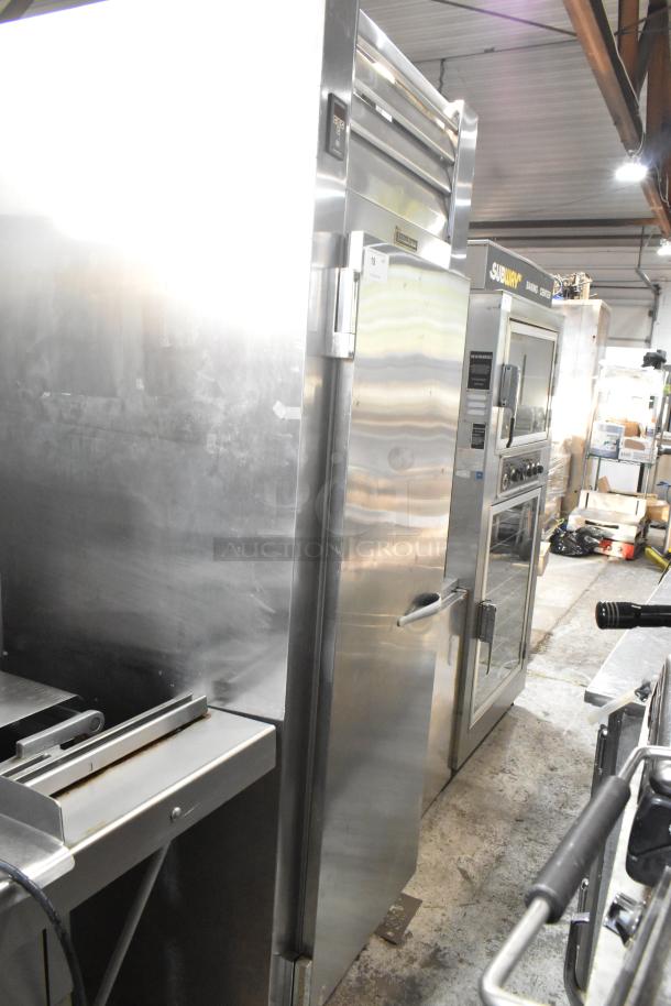 Traulsen AHT132WUT-FHS stainless steel commercial reach-in cooler, single door, with racks and casters, 115V, 1 phase.