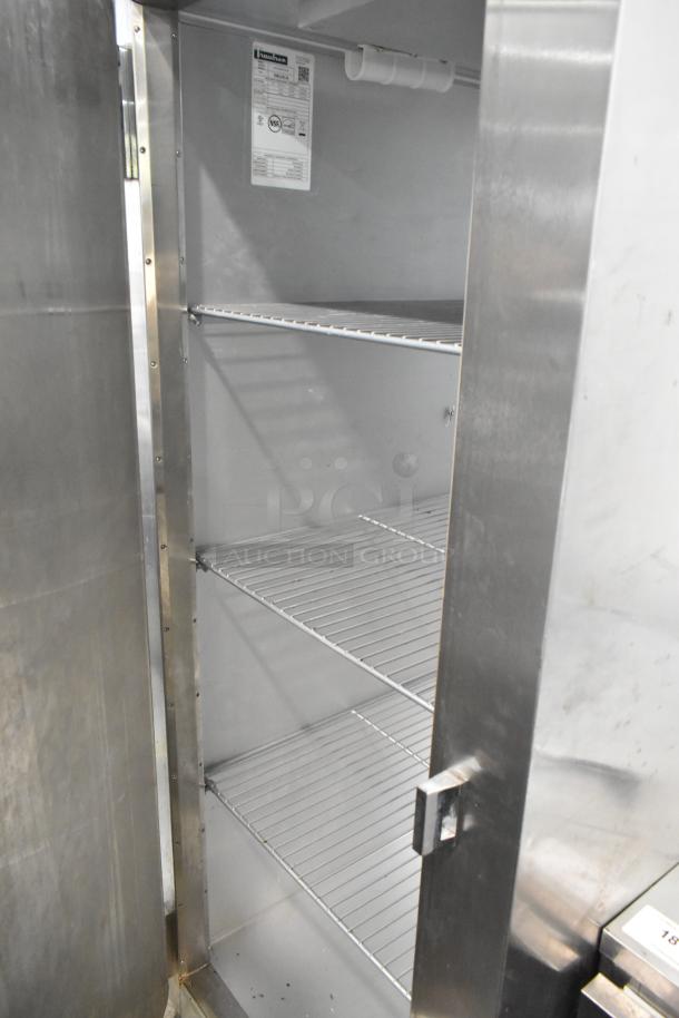 2016 Traulsen AHT132WUT-FHS stainless steel single door cooler; 115V, 1 phase, with racks, commercial casters, good condition.