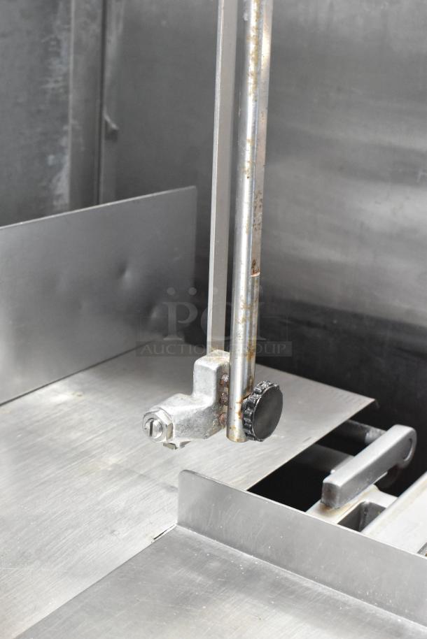 Hobart 5614 commercial meat saw, metal, floor style, 200-230V, 3 phase, visible wear, knobs and blade guide shown.