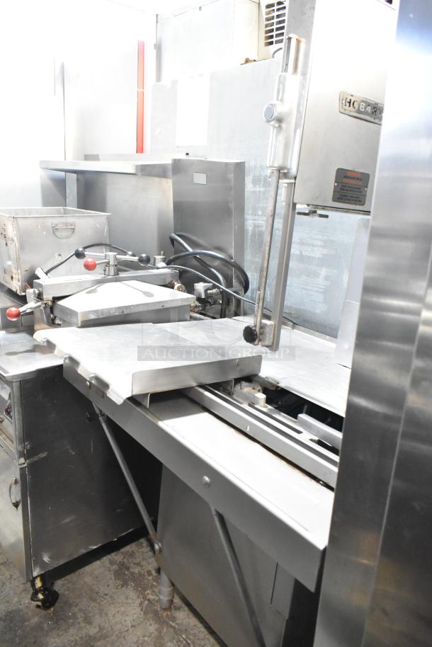 Hobart 5614 commercial floor meat saw, metal, 200-230V, 3 phase, used condition, visible controls and cutting area.