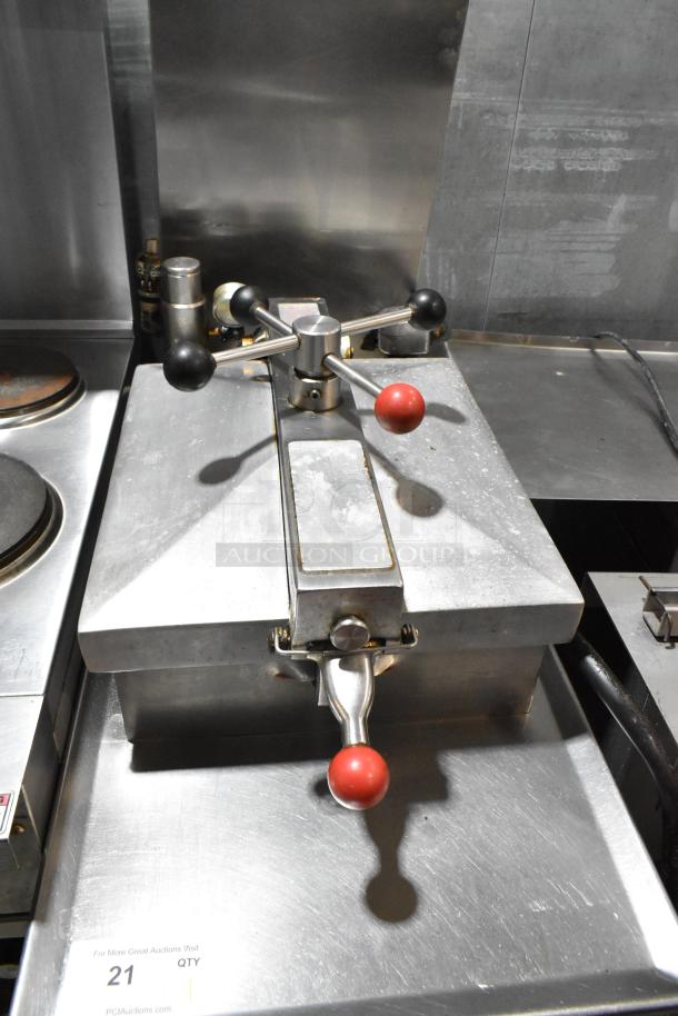 Henny Penny stainless steel commercial electric pressure fryer, 220V, 3 phase, with casters. Visible handle and control panel.
