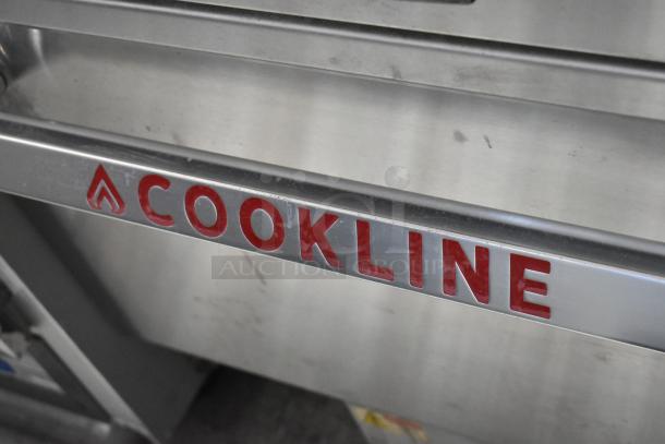 Cookline stainless steel 6 burner hot plate range with oven, over shelf, and backsplash. Red Cookline branding visible.