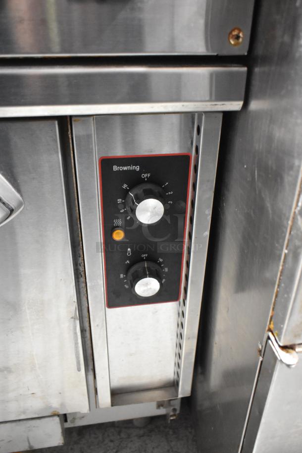 Cookline stainless steel commercial 6 burner hot plate range with oven, over shelf, and backsplash, controls visible.