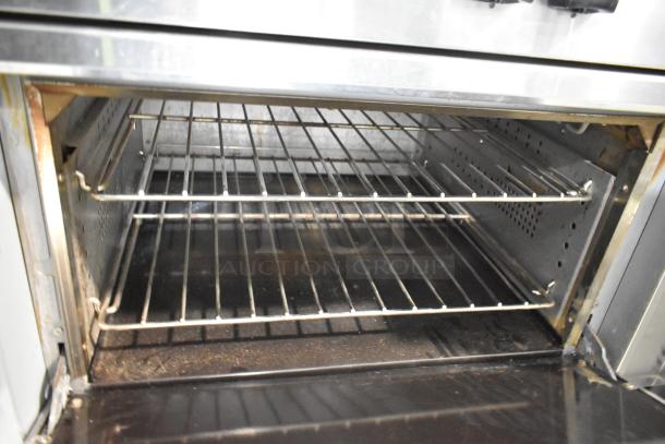 Cookline Stainless Steel 6 Burner Hot Plate Range with oven interior, featuring dual oven racks. Includes over shelf and backsplash.