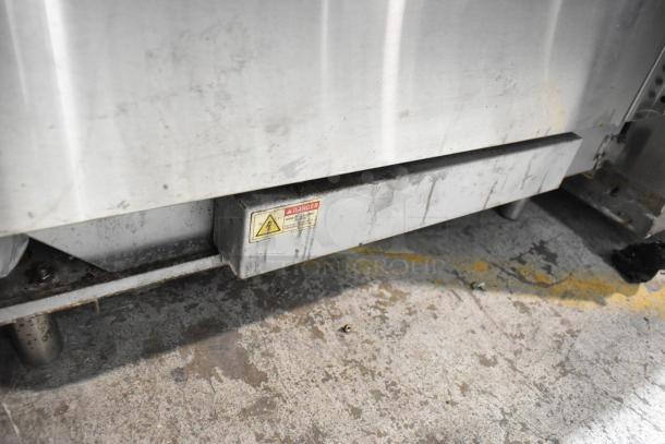 Cookline Stainless Steel Commercial 6 Burner Hot Plate Range with oven, over shelf, and back splash. Visible wear and "Danger" label.