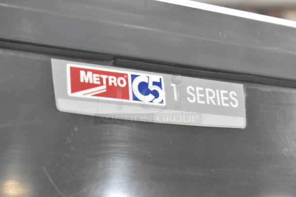 Metro C519-CFC-4 heated holding cabinet with commercial casters, shown in good condition. Label: "Metro C5 1 Series."