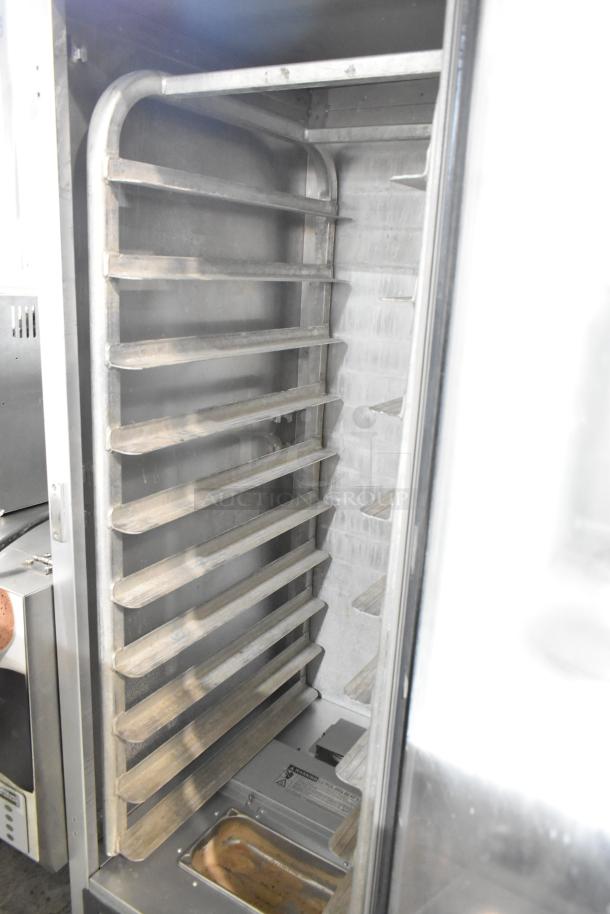 Metro C519-CFC-4 Heated Holding Cabinet on casters, metal construction, 120V, 1 phase. Good condition, internal shelves shown.