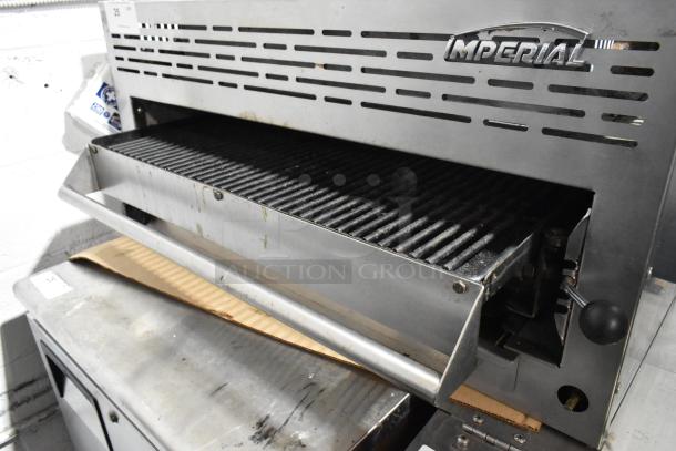 Imperial Stainless Steel Commercial Gas Cheese Melter with grill surface, used condition, showing logo and control lever.