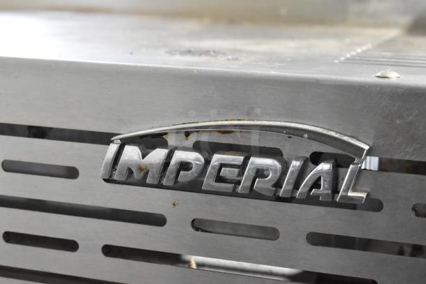 Imperial Stainless Steel Commercial Gas Cheese Melter, featuring Imperial logo, shows signs of use.