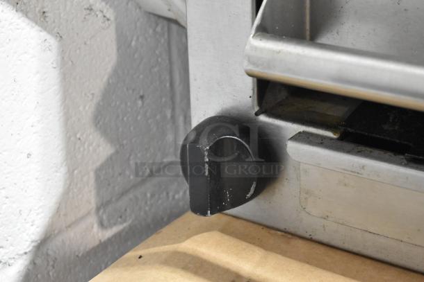 Imperial stainless steel commercial gas cheese melter, featuring a control knob, moderate wear visible.