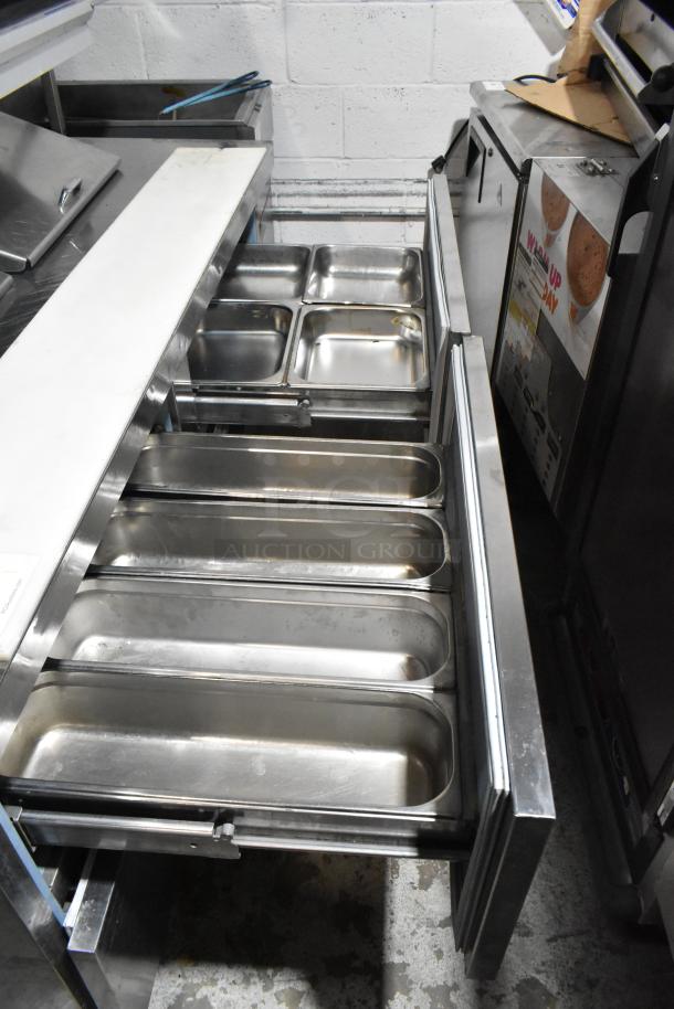 Delfield UCD4464N-12-DD5 stainless steel sandwich prep table with 4 drawers, over shelf, 115 Volts, good condition.