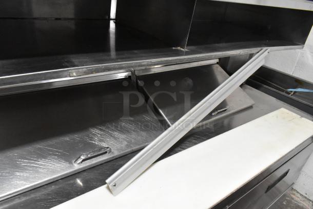 Delfield UCD4464N-12-DD5 stainless steel prep table with 4 drawers and over shelf. Scratches visible.