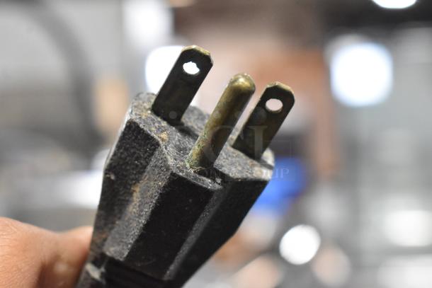 Close-up of a worn, three-pronged plug from the Star Pro Max PET14 Panini Press, 125 volts, 1 phase.