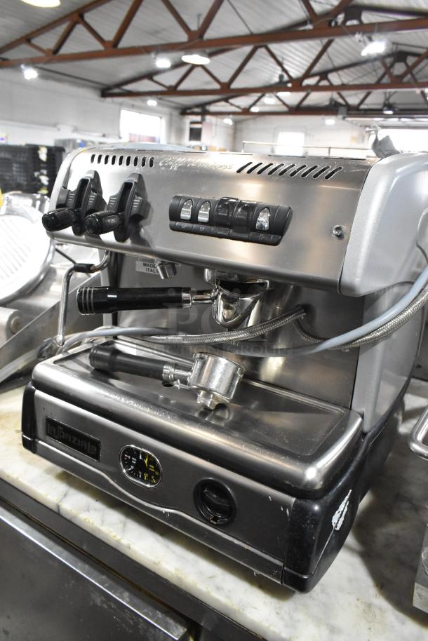 La Spaziale stainless steel commercial espresso machine, single group with portafilter and steam wand, countertop model.