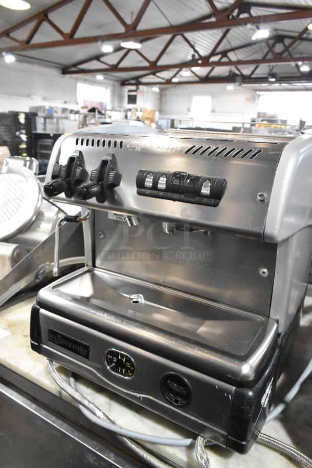 La Spaziale stainless steel commercial espresso machine with portafilter and steam wand, single group, countertop model.
