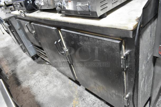 Leader LB72 Stainless Steel 3-Door Work Top Cooler on casters. Used condition. 115V, 1 phase. Model LB72 visible.