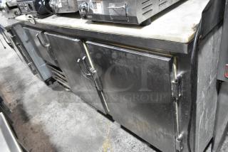 Leader LB72 Stainless Steel 3-Door Work Top Cooler on casters. Used condition. 115V, 1 phase. Model LB72 visible.