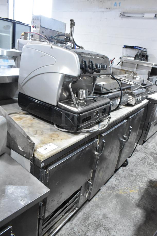 Leader LB72 stainless steel 3-door work top cooler on casters. Commercial use, 115V, 1 phase, durable condition.
