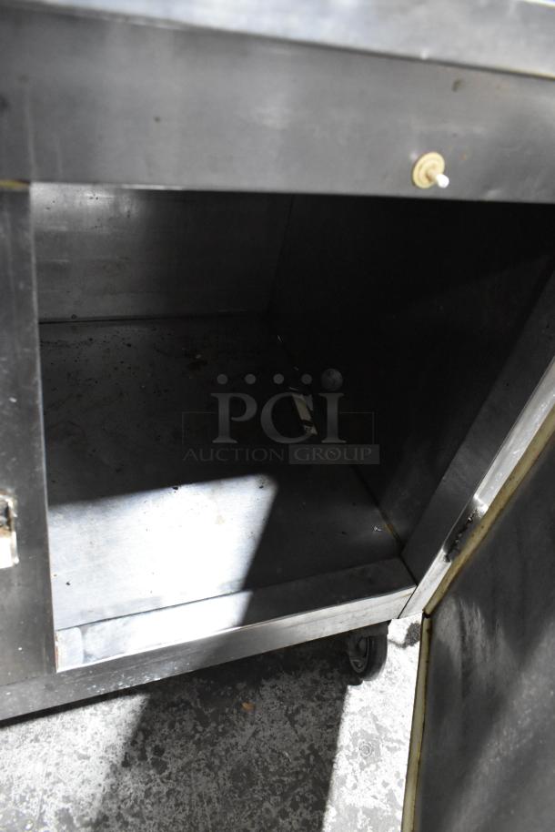 Leader LB72 stainless steel commercial 3 door work top cooler, on casters, 115 volts, 1 phase, interior view.