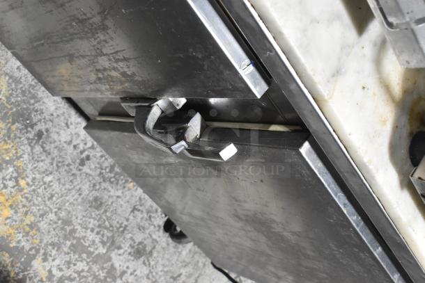 Leader LB72 stainless steel 3-door work top cooler on casters. Visible wear, sturdy handles, 115V, 1 Phase.