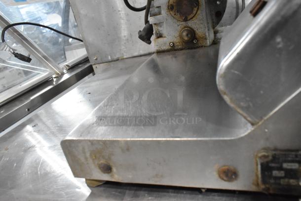 Globe 500 stainless steel meat slicer, countertop model, 115V, 1-phase, signs of wear on surface.