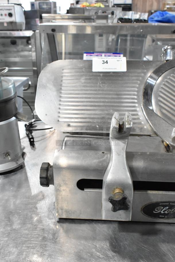 Globe 500 stainless steel meat slicer, commercial countertop model, 115 volts, 1 phase, used condition with visible auction label.