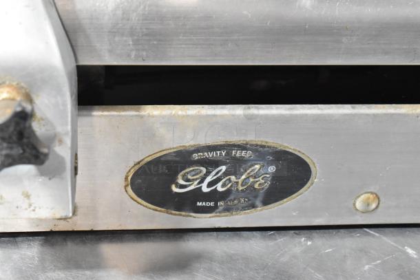 Globe 500 Stainless Steel Meat Slicer, commercial countertop model. Features Gravity Feed label. Made in USA, 115V, 1 Phase.