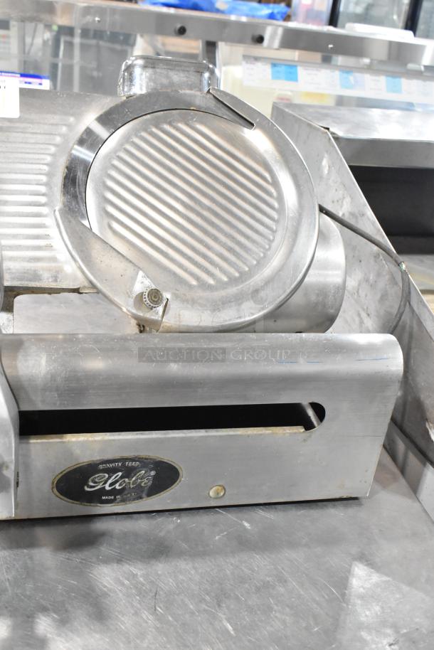 Globe 500 Stainless Steel Commercial Meat Slicer, 115V, 1 Phase, visible Globe logo, used condition.