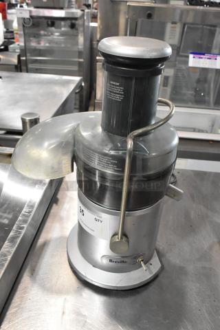 Breville Countertop Juicer, 115 Volts, 1 Phase, silver finish, visible condition wear, features safety locking arm.