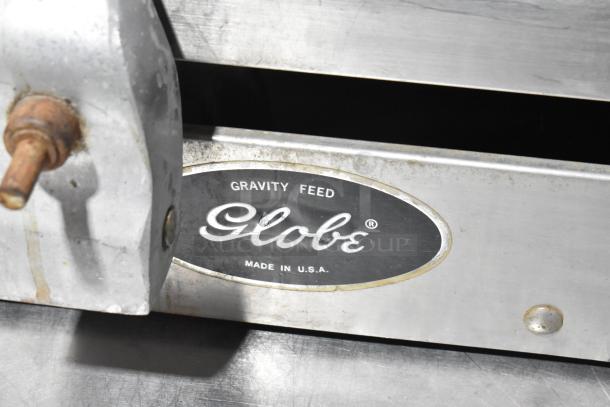 Globe 500 Stainless Steel Meat Slicer, includes blade sharpener; missing carriage. "Made in USA" label visible.
